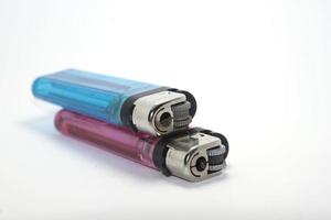 Gas-filled lighters for igniting-general or-cigarettes are modern industry and technology in this day and age in multiple colors on a white background. photo