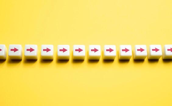 Row of blocks with arrows. Movement in one direction. Sequential chain of arrows. Set course, make your way. Moving forward, step by step. Motivation, self-development. Strategic planning. photo