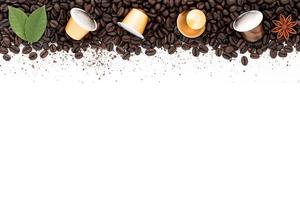 Dark roasted coffee beans setup on white background with copy space. photo