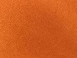 Orange velvet fabric texture used as background. Empty Orange fabric background of soft and smooth textile material. photo