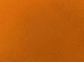 Orange velvet fabric texture used as background. Empty Orange fabric background of soft and smooth textile material. There is space for text. photo