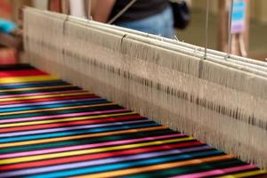 The yarn prepared inside the weaving machine is preparation for weaving local fabrics because local fabrics are handmade and have a high price because it takes quite a long time to weave. photo