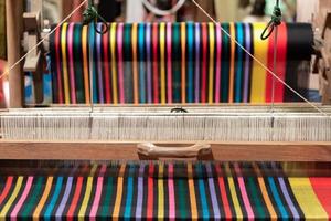 The yarn prepared inside the weaving machine is preparation for weaving local fabrics because local fabrics are handmade and have a high price because it takes quite a long time to weave. photo