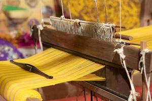 The yarn prepared inside the weaving machine is preparation for weaving local fabrics because local fabrics are handmade and have a high price because it takes quite a long time to weave. photo