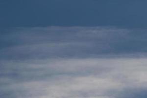 Clear blue sky and white clouds photo