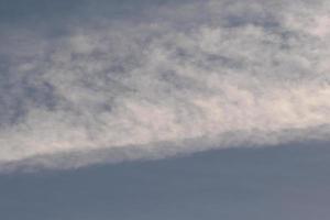 Clear blue sky and white clouds photo