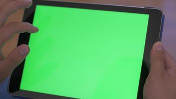 Scrolling on Tablet with Green Screen Logo Placeholder video