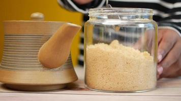 pouring white sugar in a tea cup video