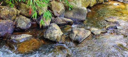 Nature river under the foot of the mountain photo