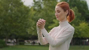 Warming up wrist joints of a woman's hands, morning training routine. video