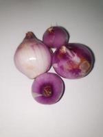 Red Onions Bawang Merah or shallots on a white background. photo