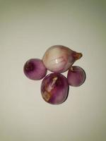 Red Onions Bawang Merah or shallots on a white background. photo