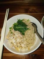 Chicken noodles with dumpling soup that is already cooked looks very delicious and tempting. photo