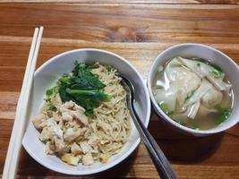 Chicken noodles with dumpling soup that is already cooked looks very delicious and tempting. photo