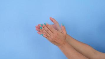Female hands clapping, celebrating, congratulating and applauding gestures isolated on pastel blue background in studio. Pack of Gestures movements and body language. video