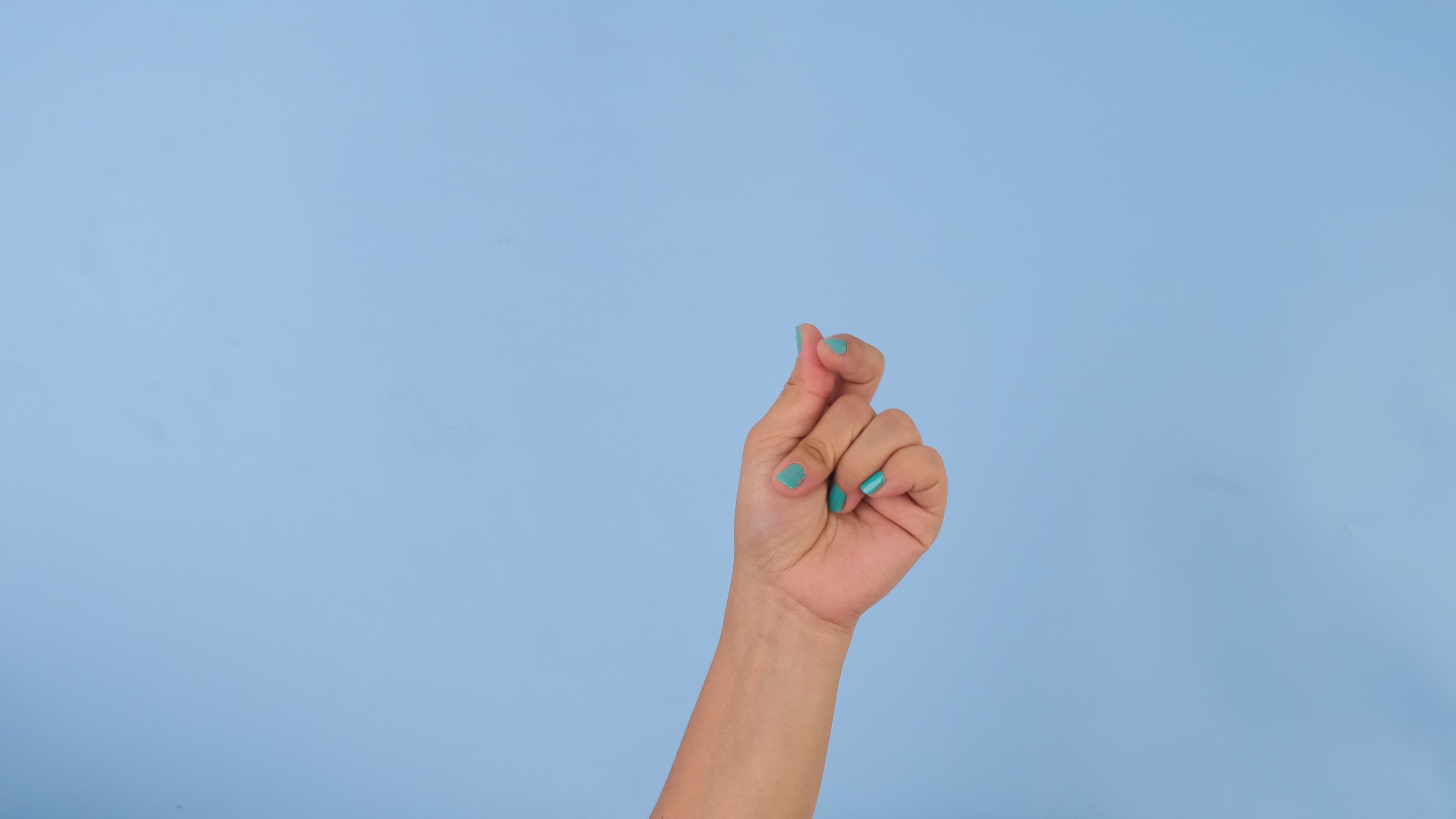 Female hand snapping fingers sign symbol on pastel blue screen background. Pack of Gestures