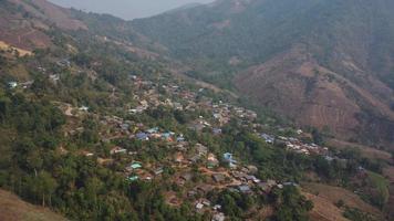 Aerial view from a drone of a small village in the mountains. Hill Tribe House video