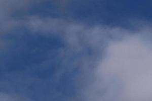 Clear blue sky and white clouds photo