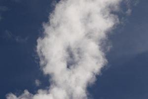 Clear blue sky and white clouds photo