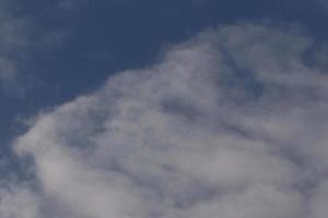 Clear blue sky and white clouds photo