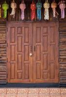 front view of entrance wood carved door, thai style photo
