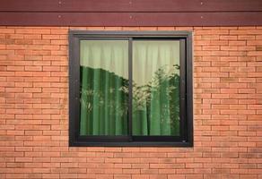 front view of window exterior on brick wall photo