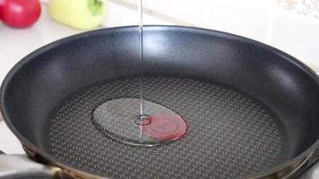 Pan with oil for cooking, kitchen interior video