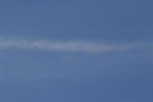 Clear blue sky and white clouds photo