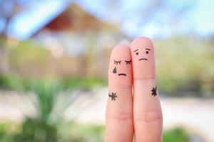 Fingers art of displeased couple. Concept of solution to the problems of family, support in difficult situations. photo