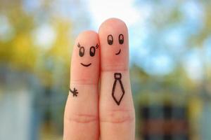 Fingers art of couple. Concept of office romance. photo