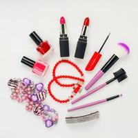 Women's accessories and cosmetics on white background. photo