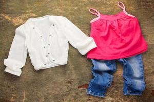 Children's clothing, jacket, shirt, jeans. Top view. photo