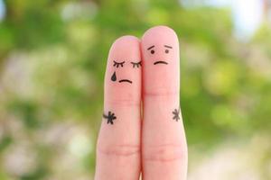 Fingers art of displeased couple. Concept of solution to the problems of family, support in difficult situations. photo