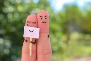 Fingers art of couple. Concept of woman hiding emotions, man is dissatisfied. photo