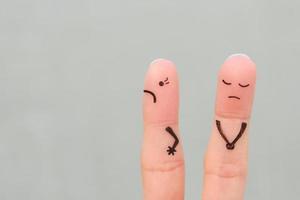 Fingers art of displeased couple. Woman was offended, man was guilty. photo