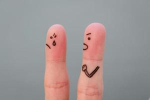 Fingers art of family during quarrel. Concept of husband shouts on wife photo