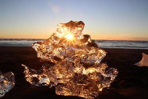 Ice on the beach at sunrise photo