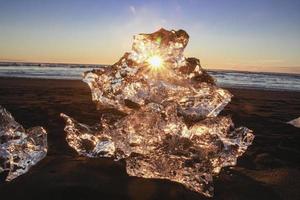 Ice on the beach at sunrise photo