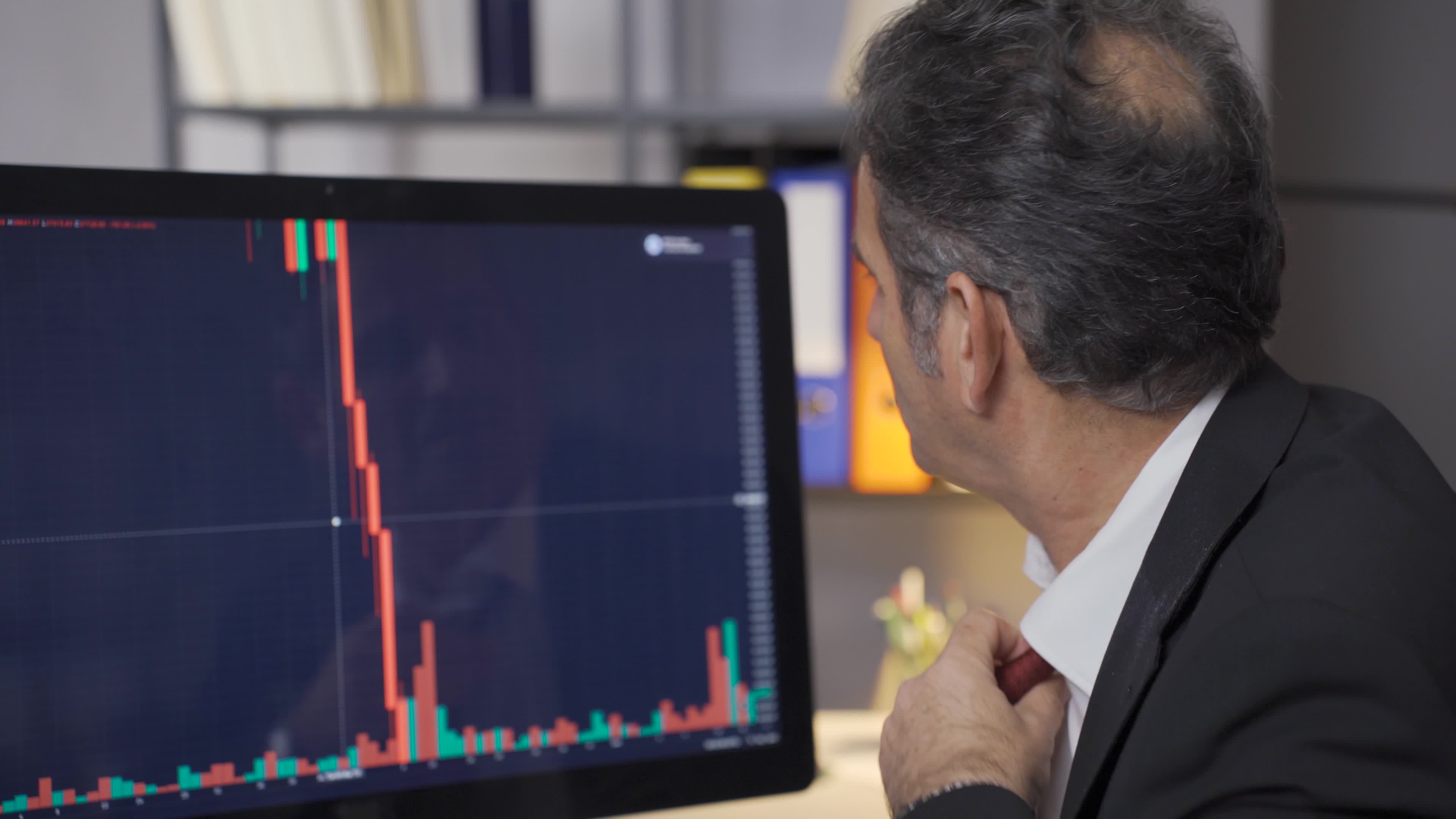 The stressed and angry stock trader is losing and its value is falling