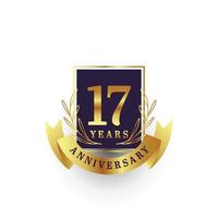 17 años aniversario oro emblema logo diseño vector