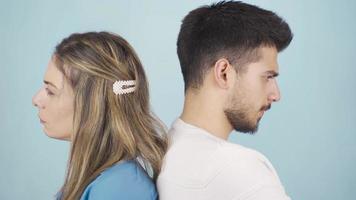 The young couple is offended and does not speak to each other. Unable to get along, the married couple is offended and turns their backs on each other. video