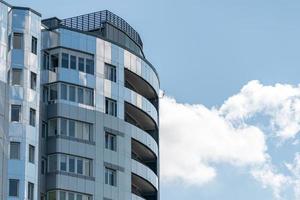 Modern high-rise building, copy space. Luxury multi storey skyscraper with flats and apartments for housing. photo