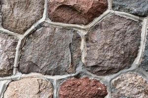 Masonry stone abstract texture on ancient foundation of cathedral. Old tile pattern. photo