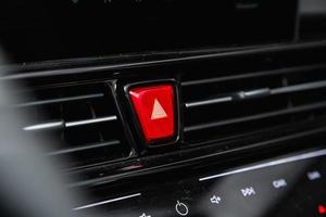 close up of  red   alarm buttons on car panel, no trade marks photo