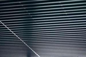 Office grille ceiling. Modern black metal grille ceiling, suspended covering. Abstract design texture. photo