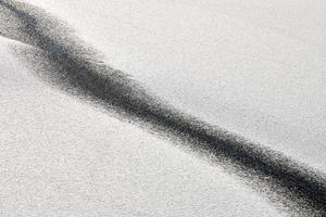 Abstract black line on snow-white background. Cracked ice photo