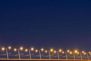 Bridge lampposts at night. photo