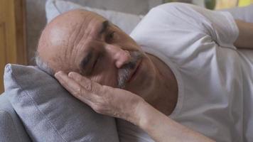 Sleeping disorder. The old man is having trouble sleeping. The old man cannot sleep and is depressed. video