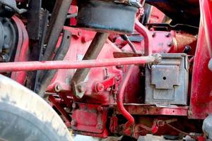 Red tractor. The concept of work in a fields and agriculture industry. photo