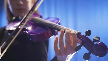 Close-up of musician playing violin on stage. Close-up of woman playing violin on opera stage or music hall. video